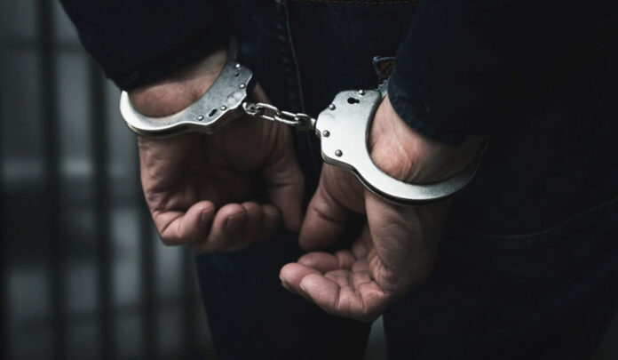 Police officials display seized heroin in Samba